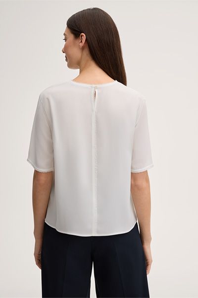 Marc Cain Crêpe Ecru Kurzarmbluse mit Fransenbesatz