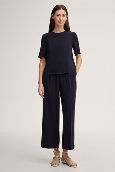 Marineblaue Crêpe Kurzarmbluse mit Fransenbesatz Rundhalsausschnitt