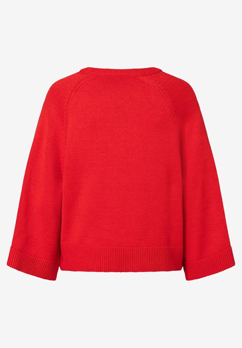 Roter Strickpullover mit weiten Ärmeln