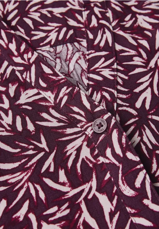 Gemustertes Kleid mit V-Ausschnitt und Bindegürtel