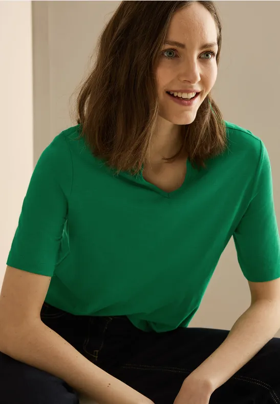 Grünes T-Shirt im Tunika-Stil mit V-Ausschnitt
