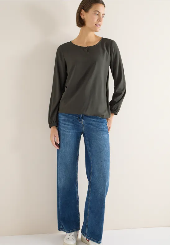 Elegante einfarbige grüne Bluse mit Cut-Out