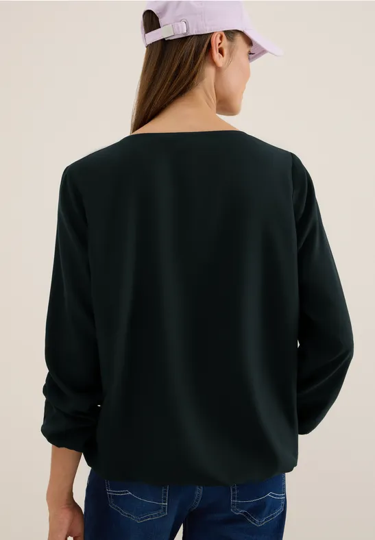 Elegante einfarbige grüne Bluse mit Cut-Out