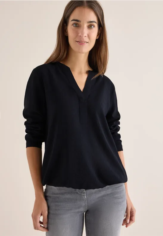 Elegante einfarbige Bluse mit Schlitzkragen