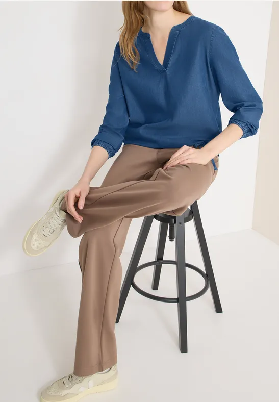 Lässige Denim-Bluse mit elastischem Saum
