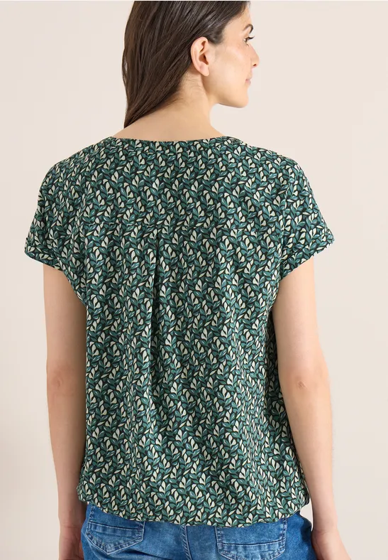 Bluse mit Blätterdruck und Schlitzkragen