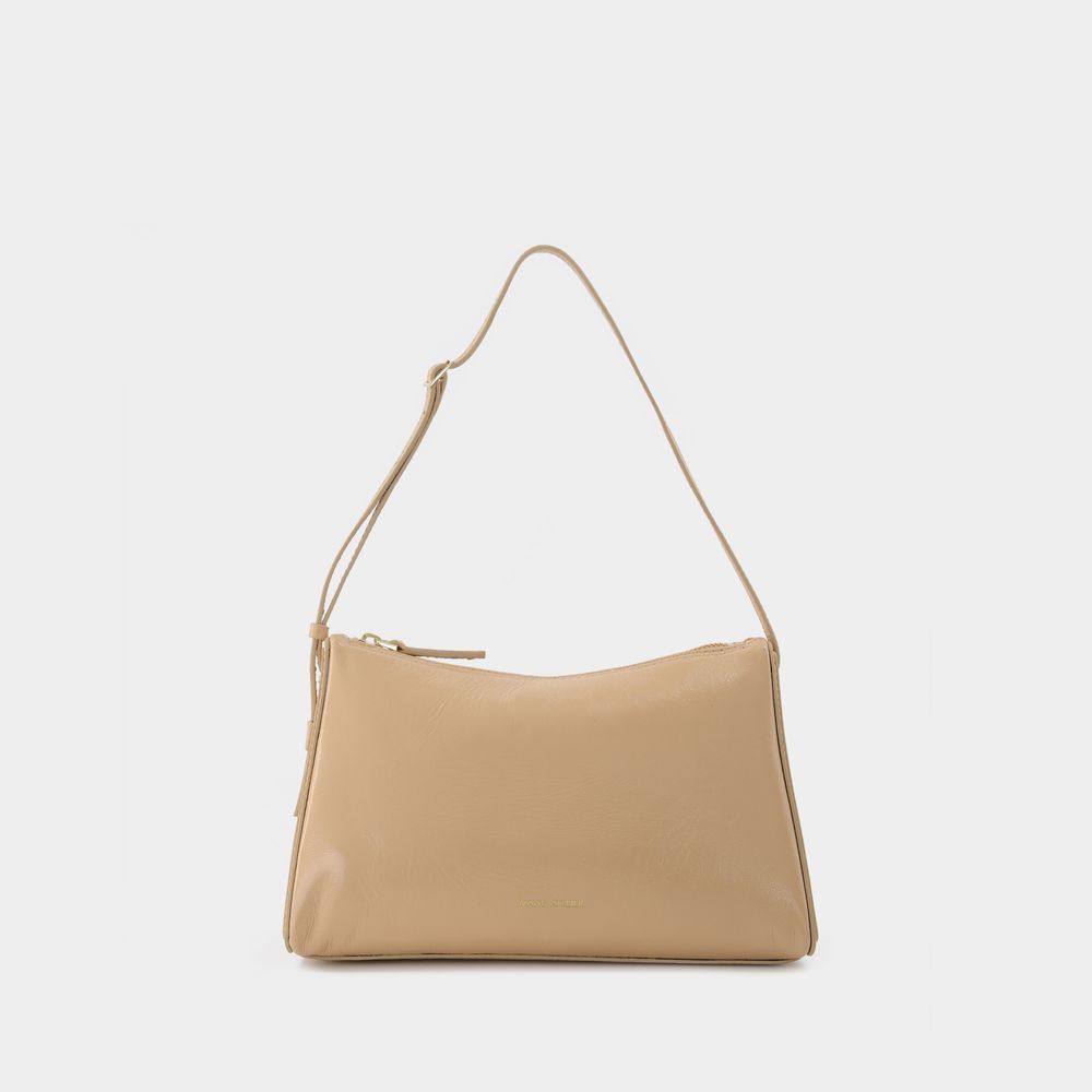 Minimalistische beige Hobo-Tasche aus Leder