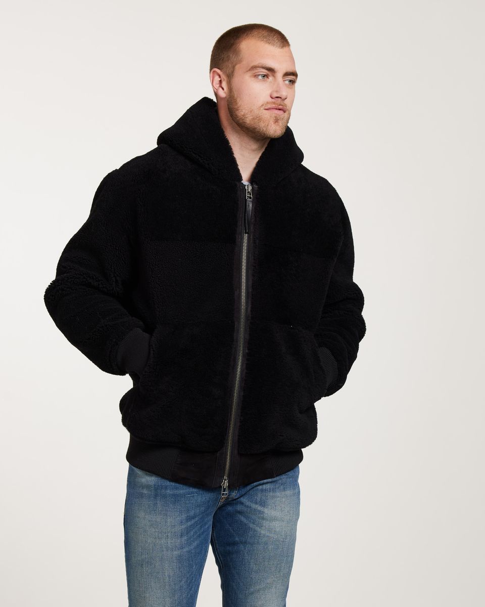 Schwarze Shearling-Jacke mit Kapuze und Reißverschluss