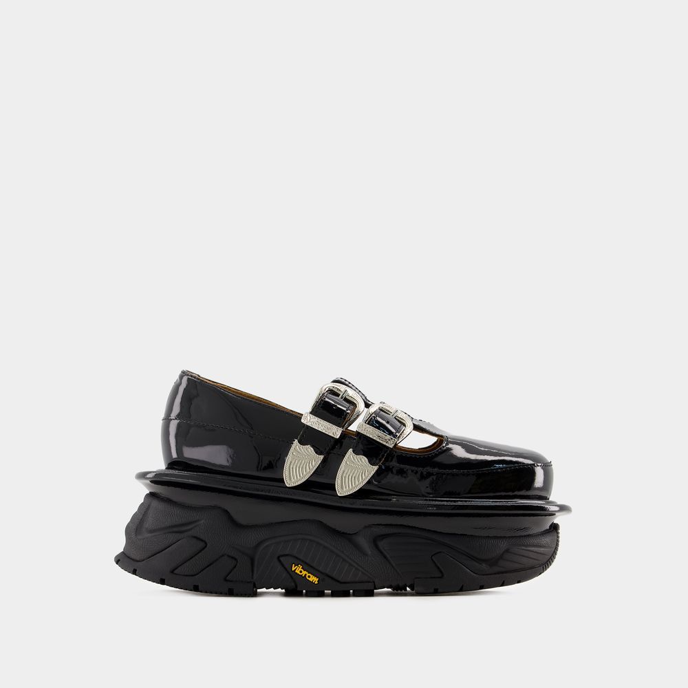 Schwarze Mary Janes aus Lackleder mit Plateausohle