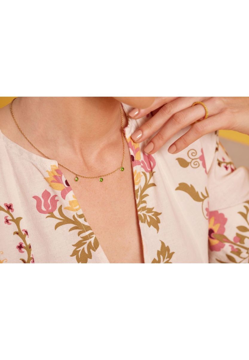 Zarte Goldkette mit grünen Kristallen