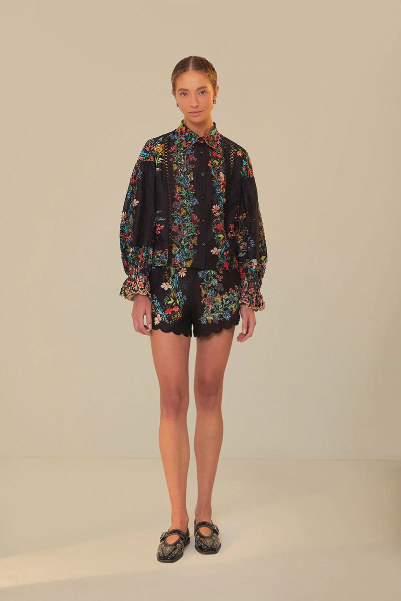 Shorts mit Blumendruck und Wellensaum
