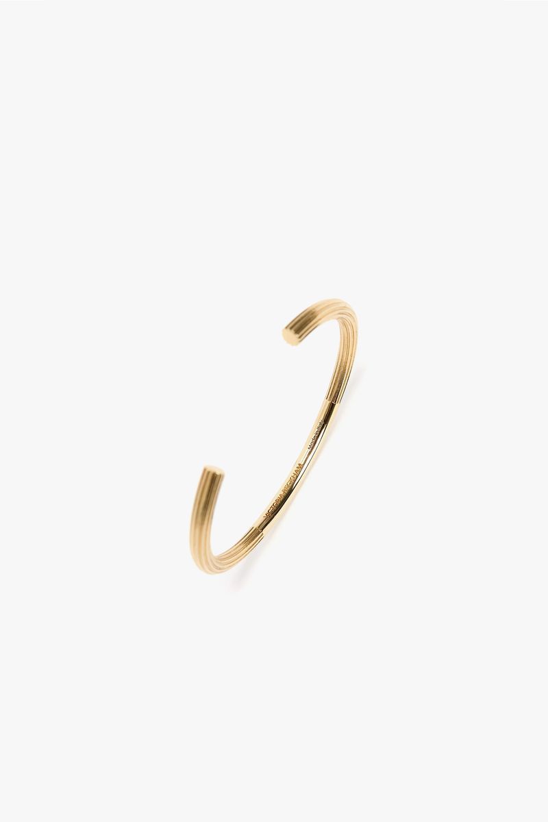 Hellgoldenes Armband im Manschettenknopf-Stil