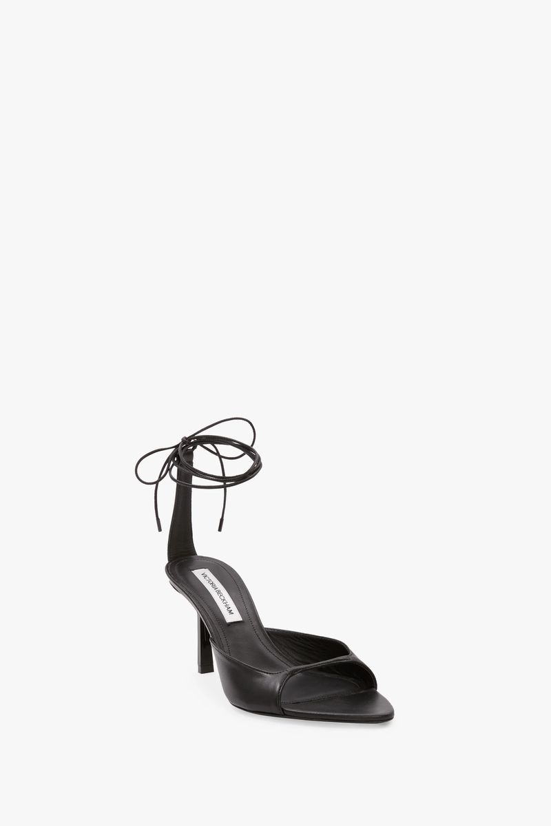 Schwarze Lederriemchen-Stiletto-Sandalen