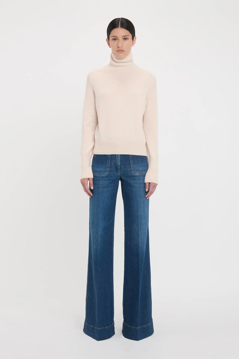 Elfenbeinfarbener Rollkragenpullover aus Lammswolle