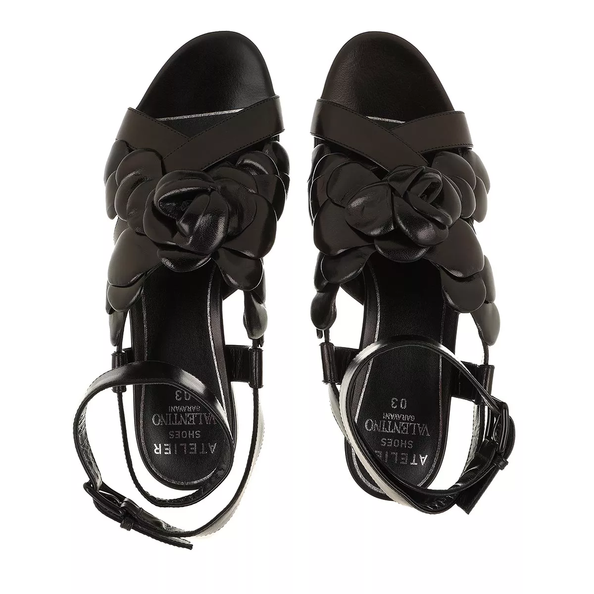 Schwarze Ledersandalen mit Rosenapplikationen