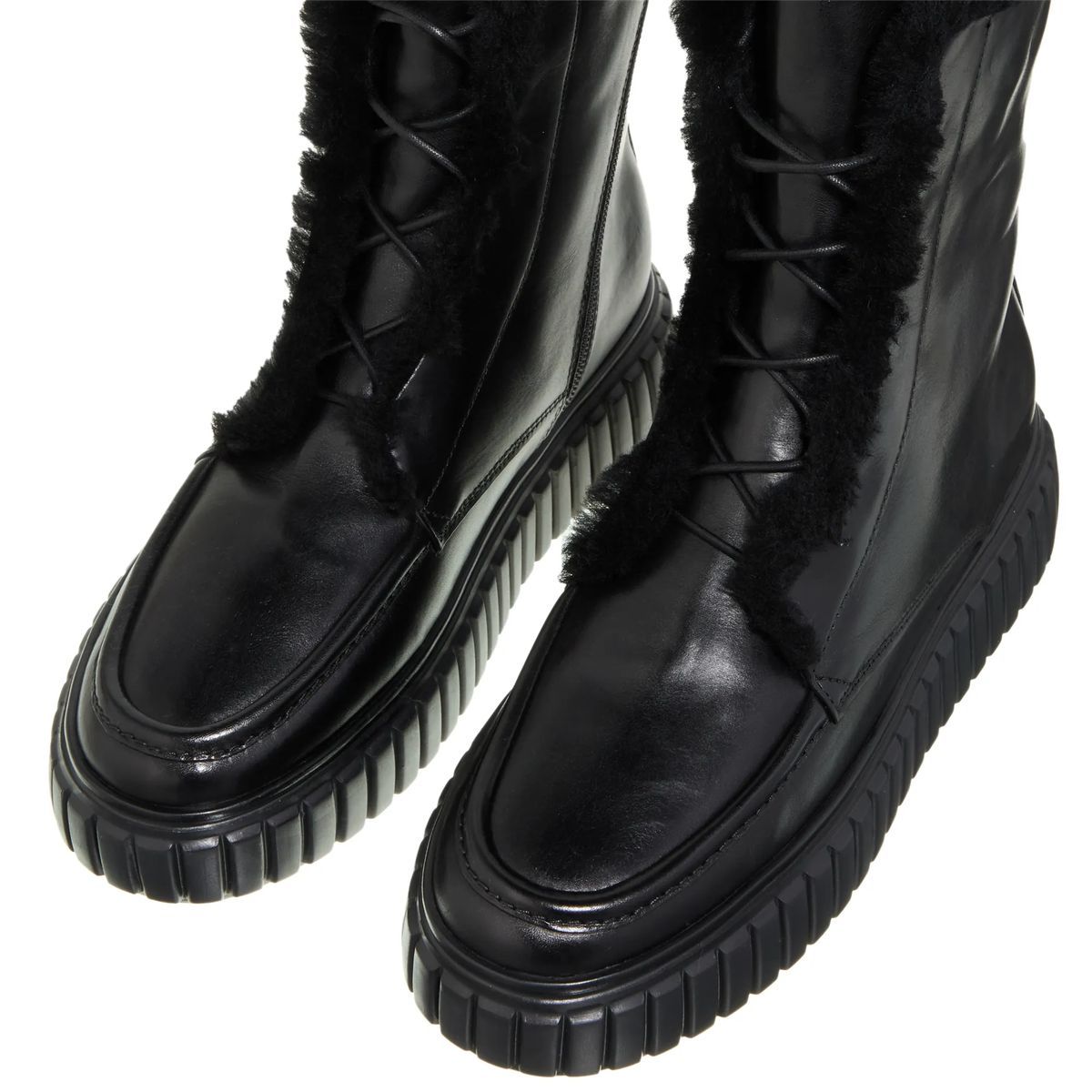 Schwarze Leder-Stiefeletten mit Fell