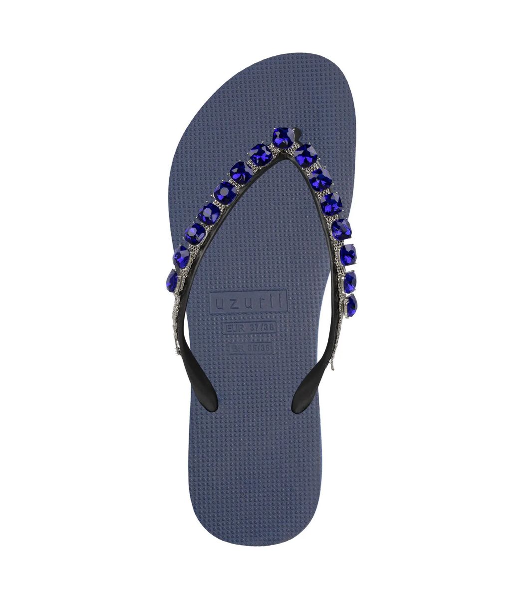Blaue juwelenbesetzte Flip-Flops