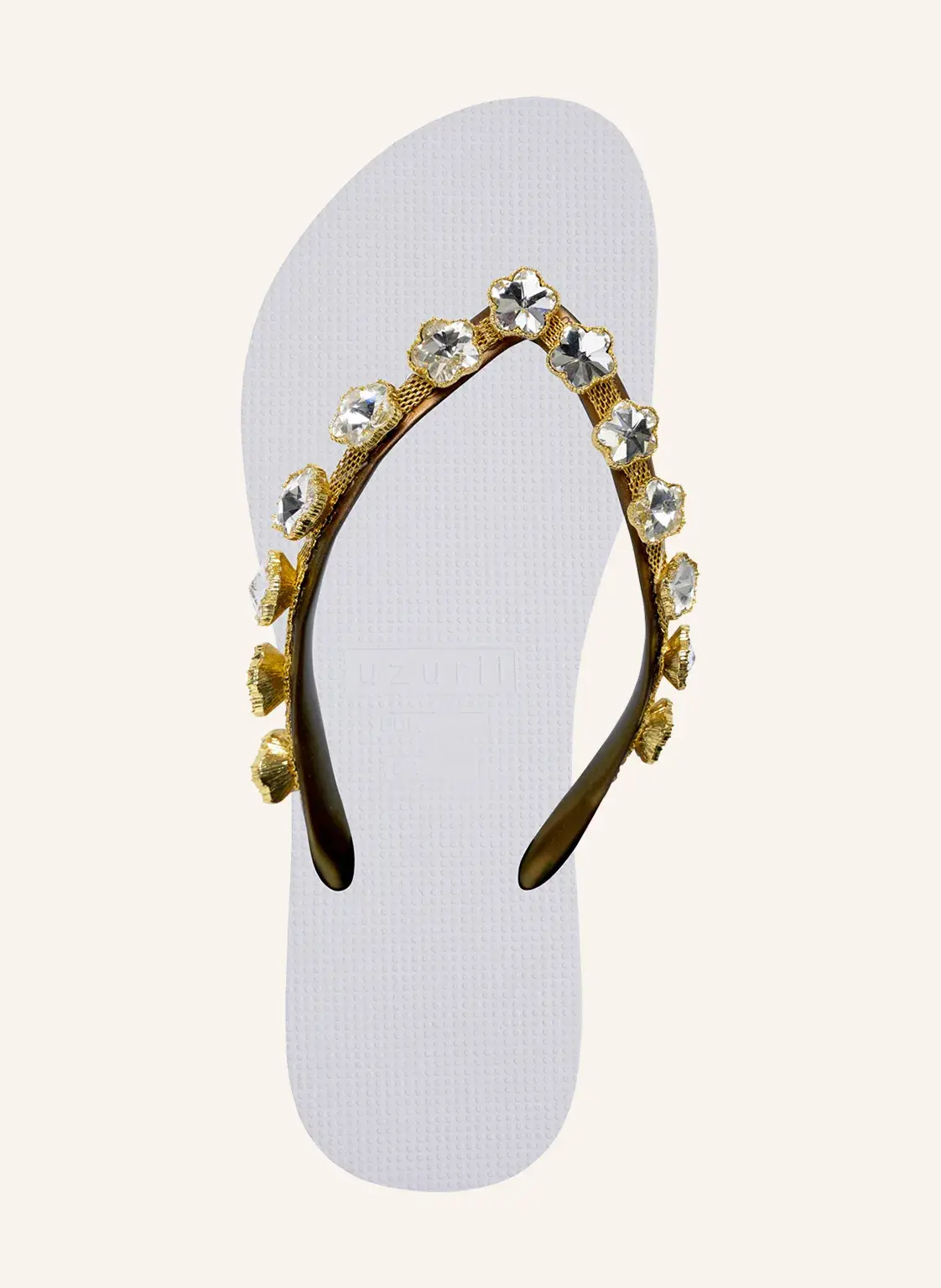 Flip-Flops mit Blumenakzent und Schmucksteinen