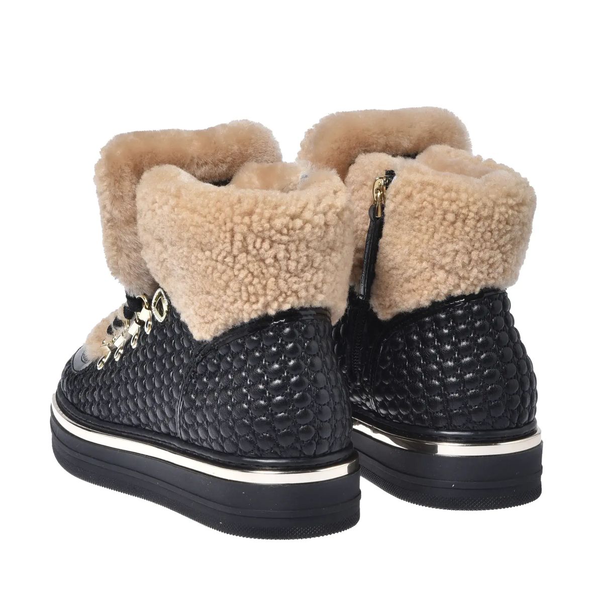 Sneakers aus gestepptem Leder mit Shearling-Akzent