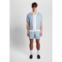 Badeshorts mit geometrischem Blumenmuster