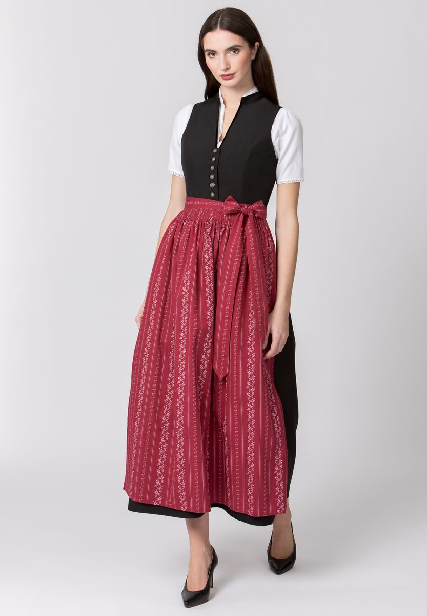 Traditioneller roter Dirndlrock mit Blumenmuster
