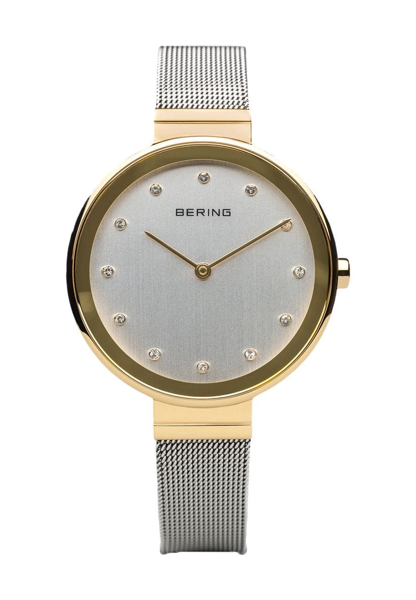 Elegante goldfarbene Damenuhr mit Kristallen