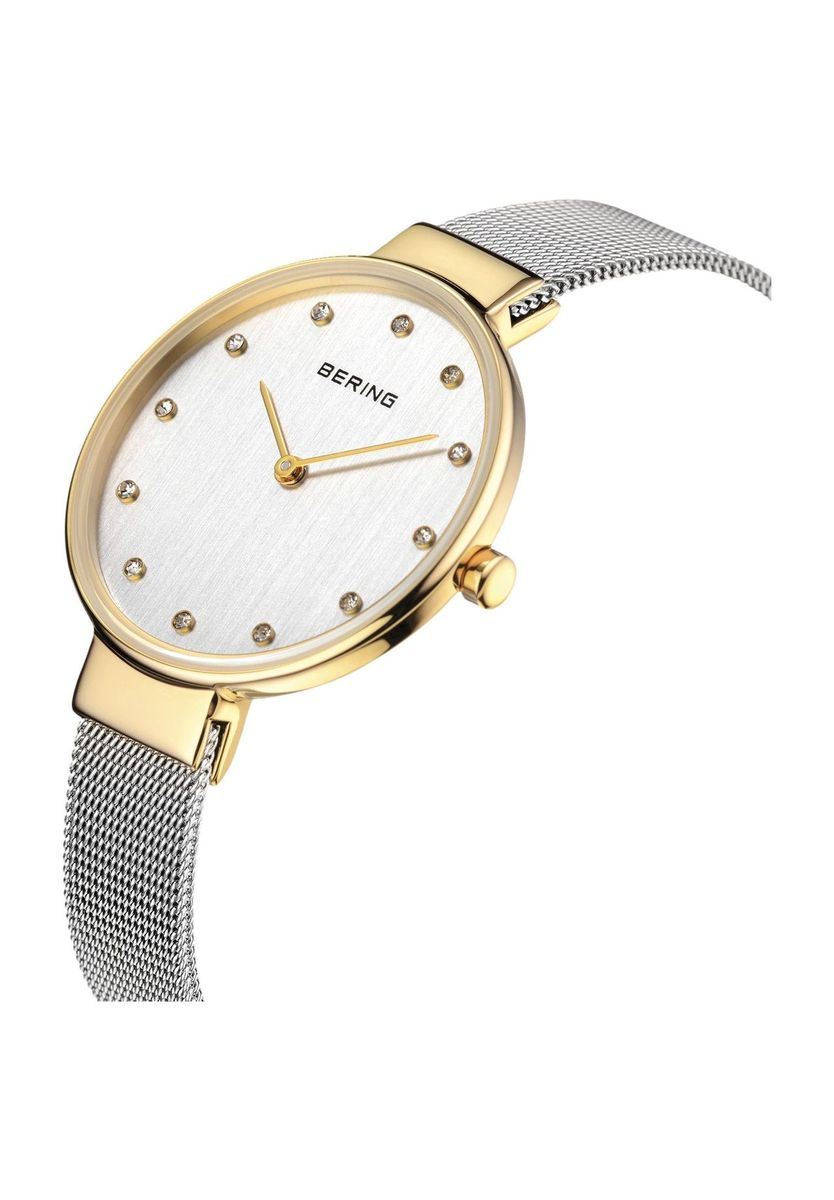 Elegante goldfarbene Damenuhr mit Kristallen