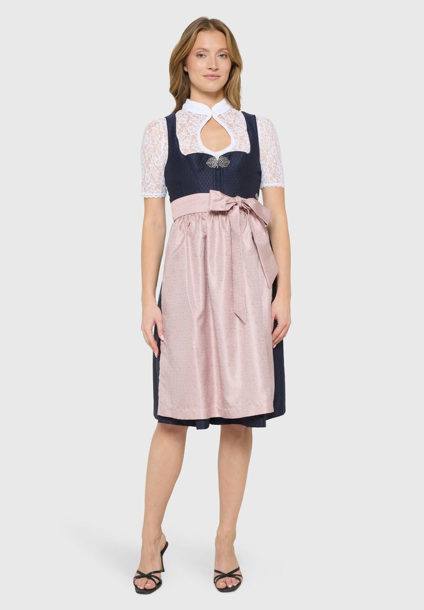 Traditionelles Dirndl mit schimmernder Schürze