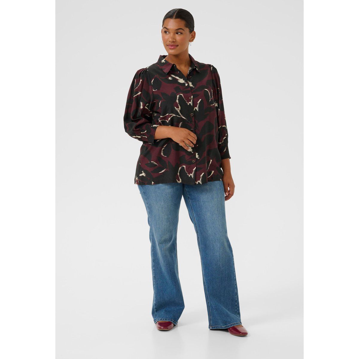 Bluse mit abstraktem Muster und Smokbund
