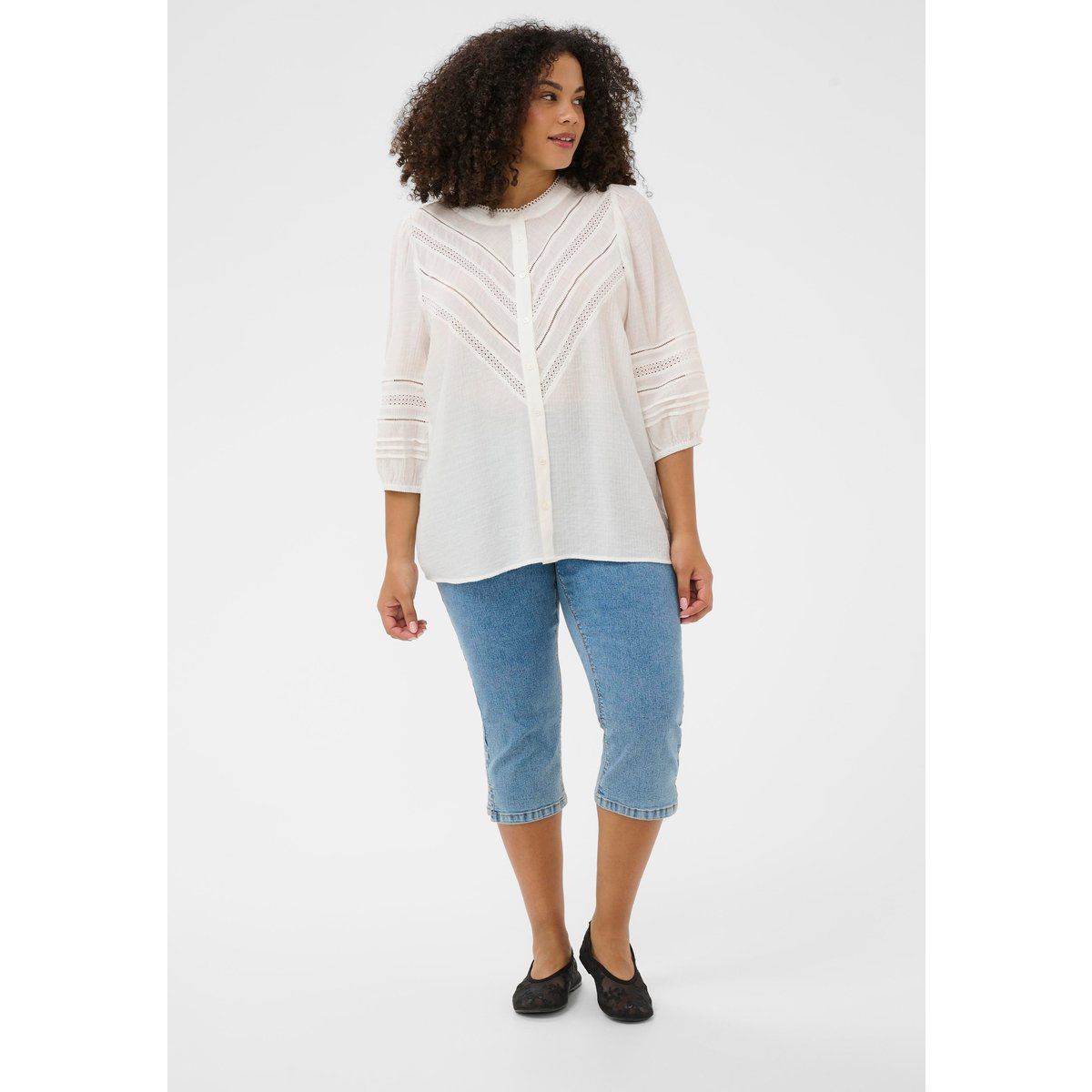 Bluse mit Chevron-Spitze und Puffärmeln