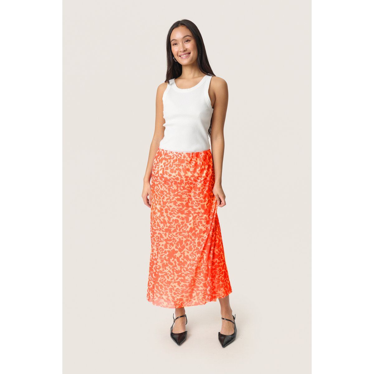 Lebendiger orangefarbener Midirock mit Blattmuster