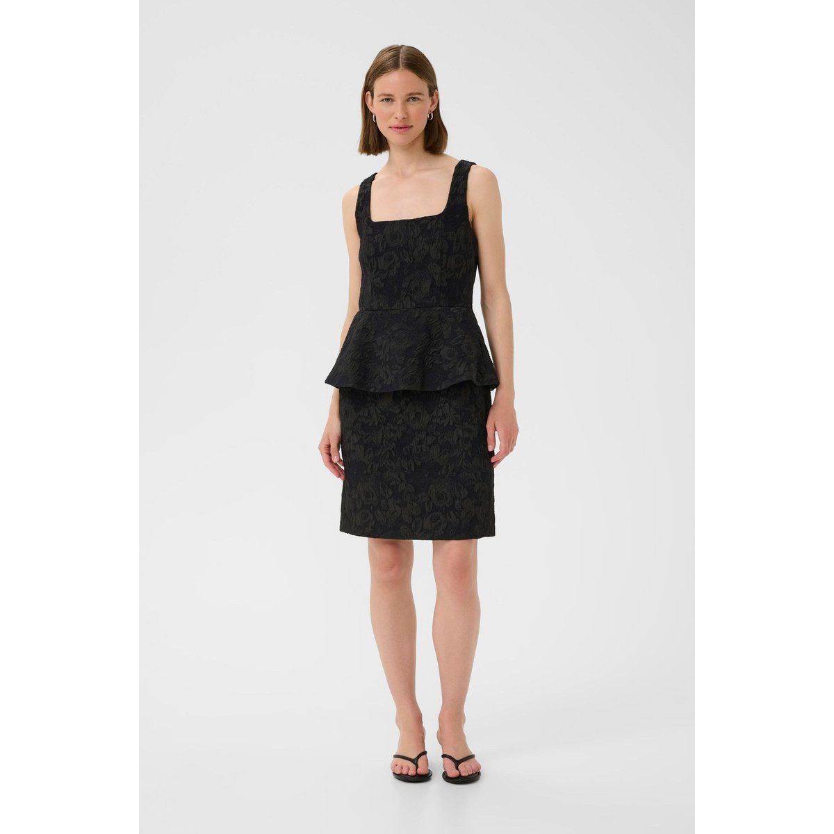 Elegantes schwarzes Peplum Etuikleid