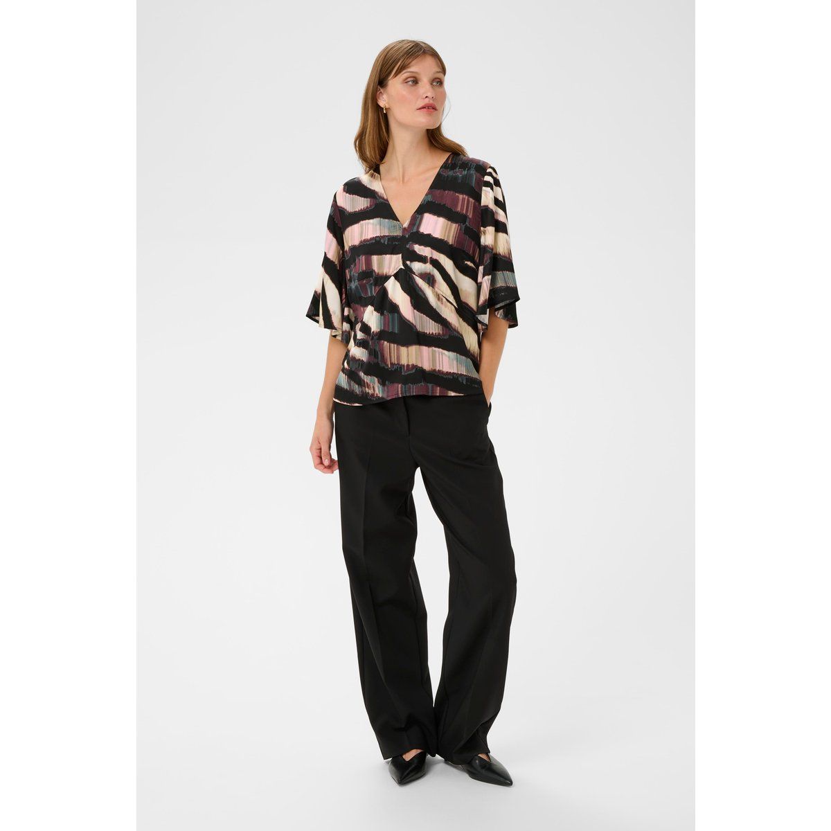Bluse mit Pinselstrichmuster und V-Ausschnitt